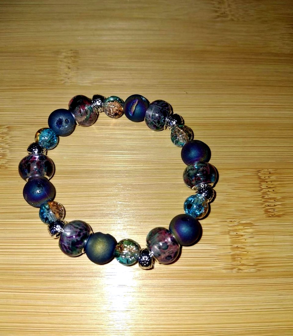 Moody Multi-Tone Bracelet: Deep blue, teal, purple, and speckled glass bracelet with silver-tone metal accents.