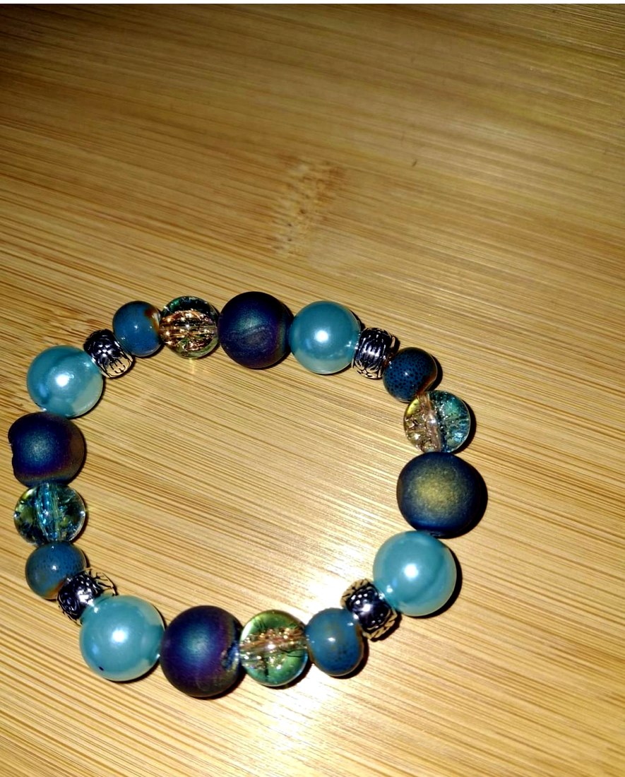 Teal Druzy Agate Quartz Bracelet: Teal bracelet made with dyed electroplated druzy agate quartz crystal gemstone, resin, glass, porcelain, and metal accents.